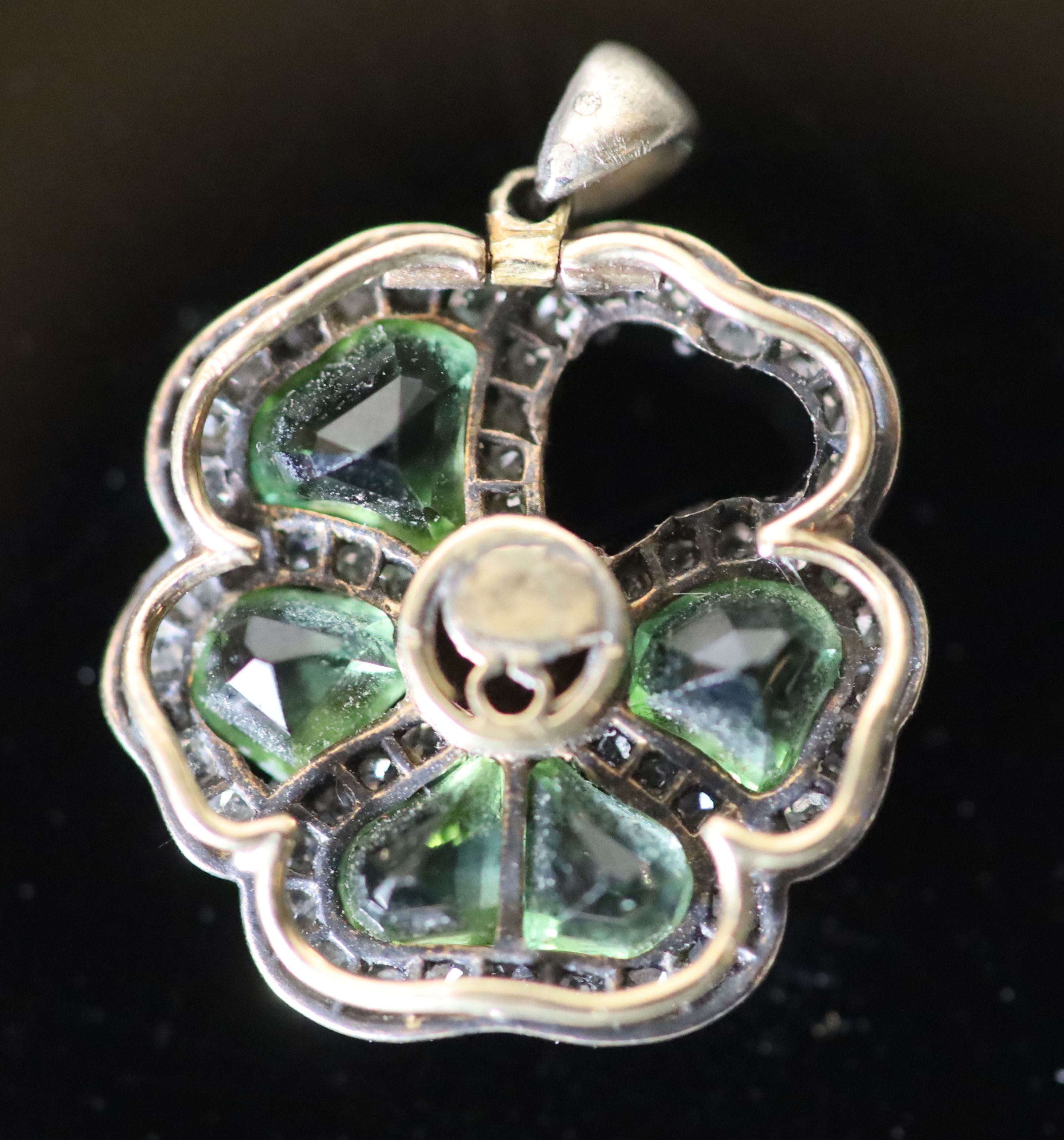 A late Victorian gold and silver, shaped chrysoberyl? and rose cut diamond set pansy cluster pendant (stone missing),